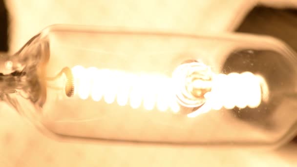 Close up shot of a Tungsten lamp with dimmer light. - Video, Çekim