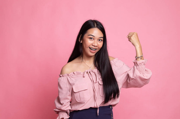 Successful  young Asian woman hold fist up. - Φωτογραφία, εικόνα