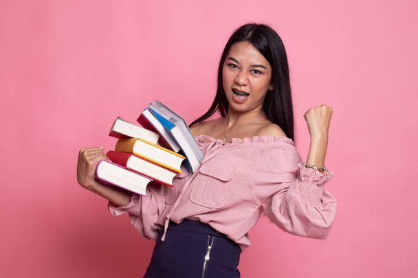 Young Asian woman studying  with may books. - Foto, Imagem