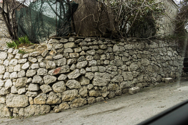 The retaining wall is made of cornering stone. - Photo, Image