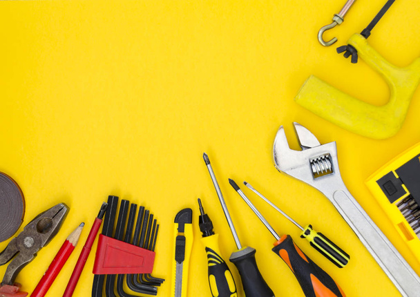 DIY tool set. Tools lie on a yellow background. There is a place for text. - Foto, Imagem