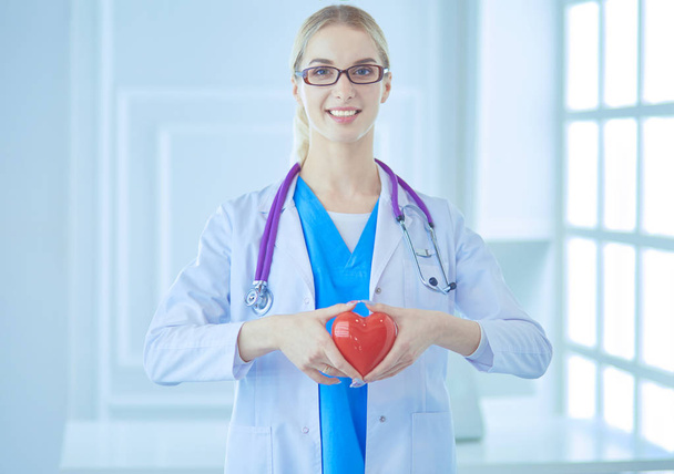 healthcare and medical concept - female doctor with heart - Foto, Imagem