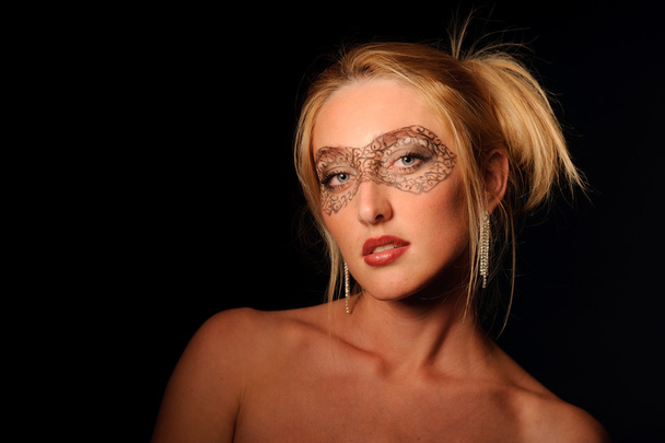 Portrait of sexy woman in make-up party mask - Fotó, kép