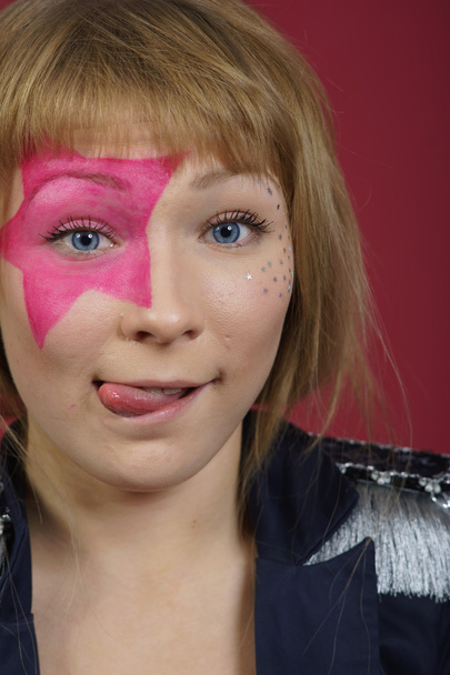 Teenager with pink star on the face - Φωτογραφία, εικόνα