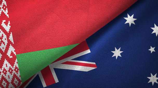 Wit-Rusland en Australië twee vlaggen textiel doek, stof textuur  - Foto, afbeelding