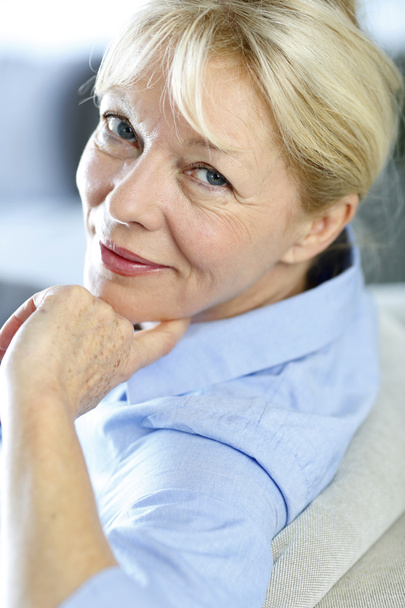 Closeup of senior woman with blue shirt - Photo, image