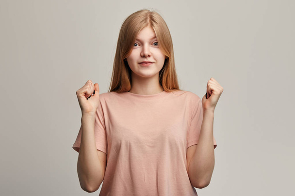 emotional excited woman controls emotions with raised hands - Foto, Imagen