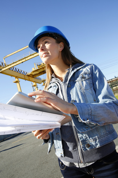 Woman engineer on building site using tablet - Photo, image
