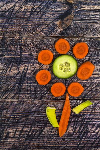 flower vegetable early board wooden carrots cucumber leek - Фото, изображение