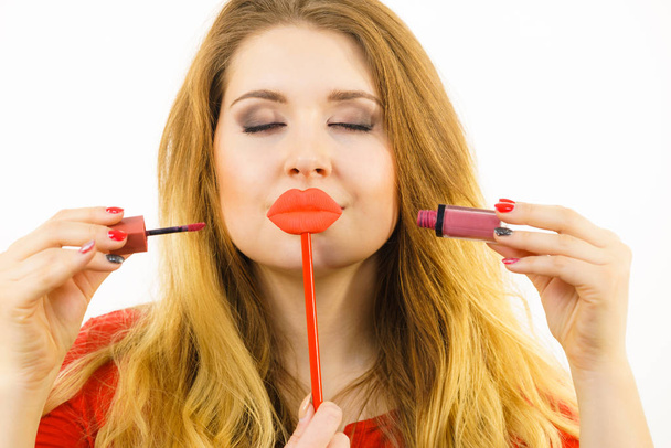 Woman applying lipstick or lip gloss - Foto, Bild