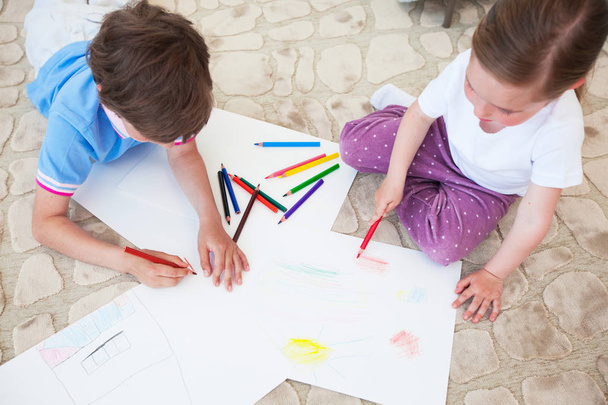 Children drawing with color pencils - Фото, изображение
