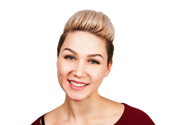 Young smiling woman with modern short hairstyle. Close up portrait of girl with blonde short hair. Portrait of attractive modern girl, isolated on white background. - Photo, Image