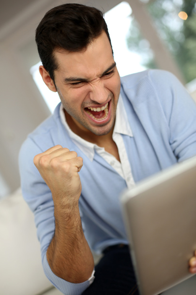 Man screaming in front of digital tablet - Photo, image