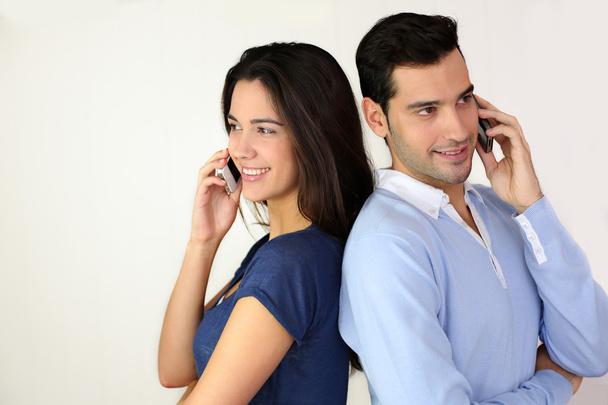 Couple talking on the mobilephone - Photo, image