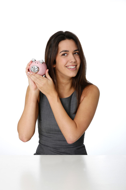 Portrait of beautiful woman holding piggy bank - Zdjęcie, obraz