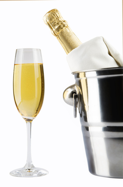 Bottle of champagne in cooler over white - Foto, Imagem