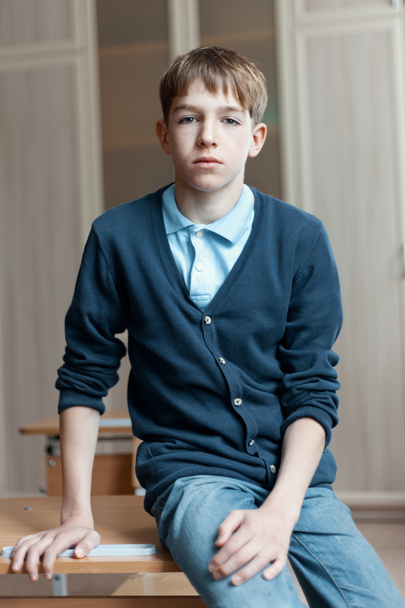 Portrait of serious teenage boy in class - Fotoğraf, Görsel