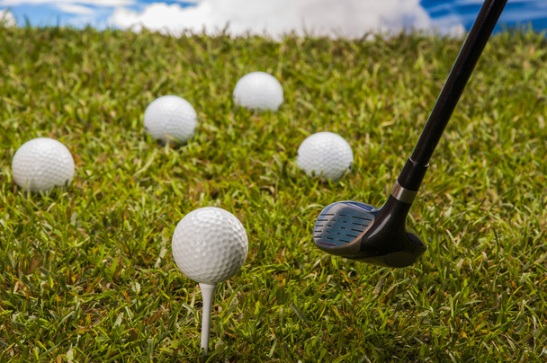 Golf theme on green grass and sky background - Zdjęcie, obraz