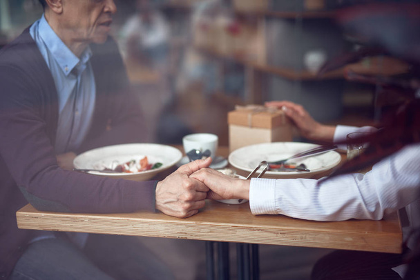 Beloved aged couple enjoying meeting in cafe - Zdjęcie, obraz