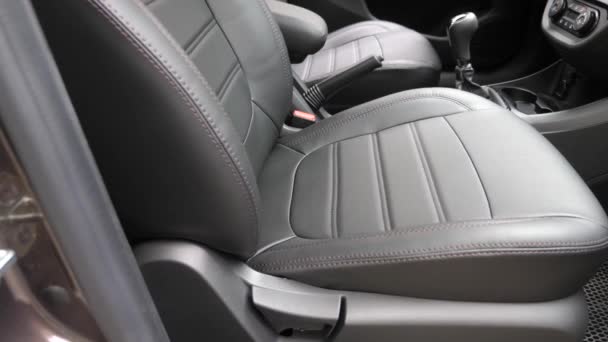 stylish black leather seats in the car. beautiful leather car interior design. luxury leather seats in the car. - Footage, Video