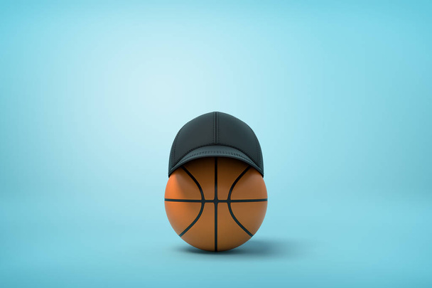 3d rendering of basketball with black baseball cap on top on light-blue background with copy space. - Foto, afbeelding