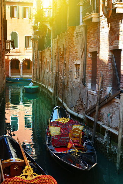 Venice, Italy. Gondolas in a romantic narrow canal - Photo, Image