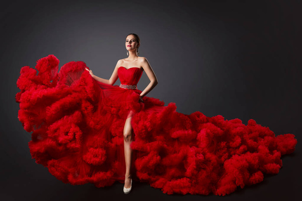 Woman in Red Ruched Dress, Fashion Model in Long Fluffy Waving Gown - 写真・画像