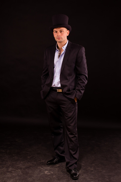 Elegant young man in black suit - Фото, зображення