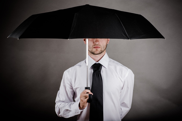 Business man with an umbrella - Photo, image