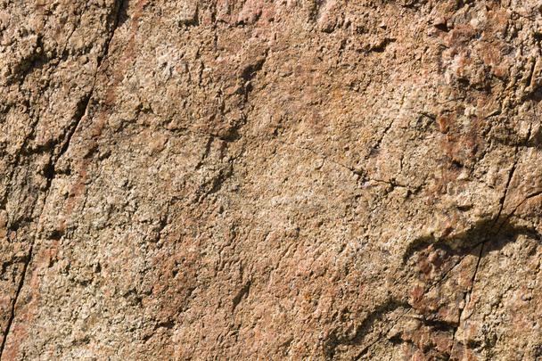 Background of granite. Texture of granite stone. Pattern of roughened surface. Texture of brown stone - Fotó, kép