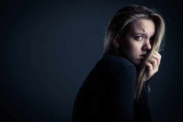 Young woman suffering from a severe depression/anxiety - Foto, Bild