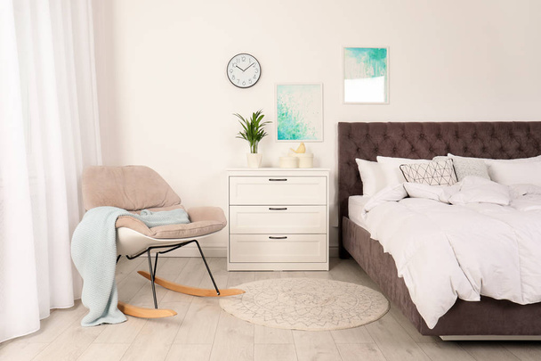 Modern bedroom interior with comfortable chair. Stylish design - Foto, immagini