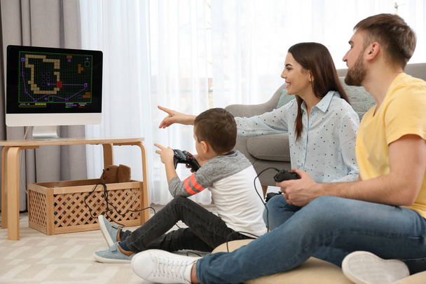 Happy family playing video games at home. Space for text - Foto, Imagen