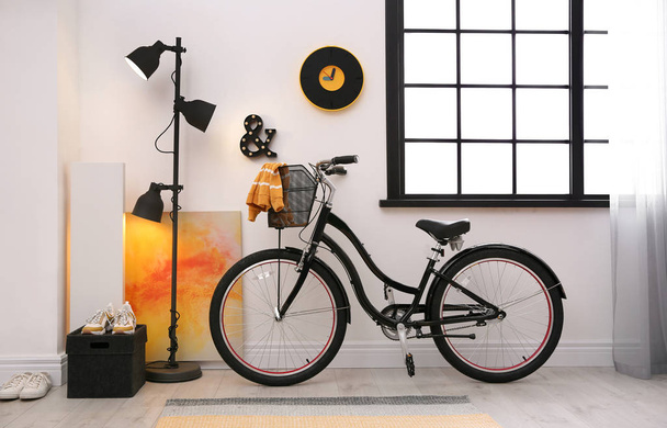 Stylish room interior with modern bicycle. Hipster design - Photo, Image
