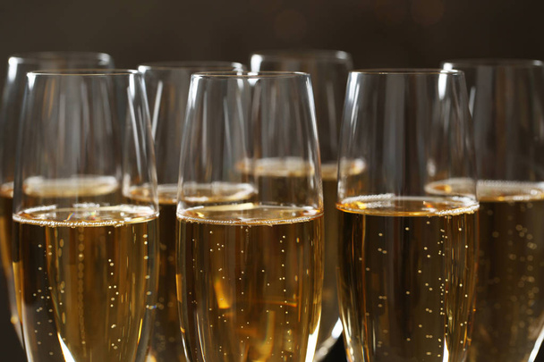 Glasses of champagne on dark background, closeup - Photo, Image