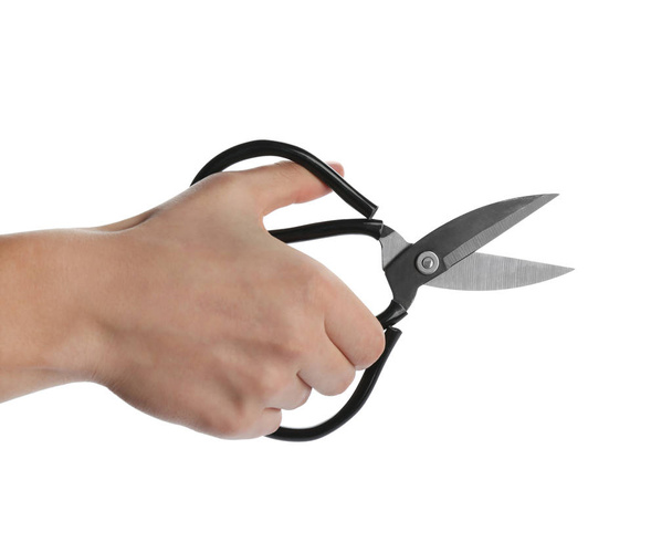 Man holding pair of sewing scissors isolated on white, closeup - Foto, Imagem