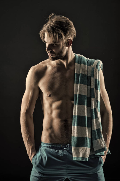 Spa man with towel, hygiene after training. Spa model with with fit bare chest and belly muscles, health, vintage - Foto, imagen