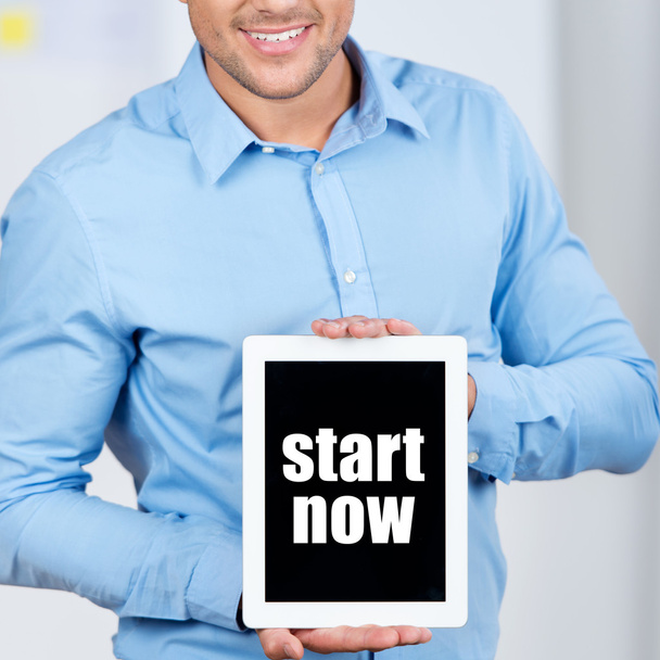 Businessman Holding Digital Tablet With Start Now Sign - Фото, изображение