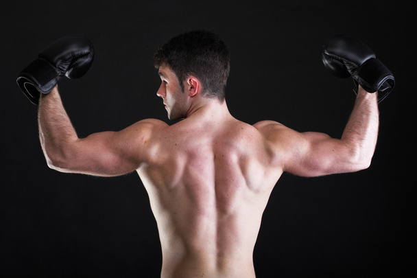 Portrait sportsman boxer in studio dark background - Fotografie, Obrázek