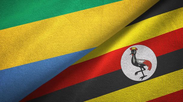 Gabon és Uganda két zászló textil ruhával, szövet textúra - Fotó, kép