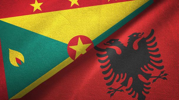 Grenada és Albánia két zászló textil ruhával, szövet textúra  - Fotó, kép