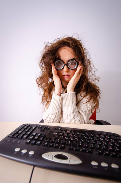 Funny nerd girl working on computer - Photo, Image