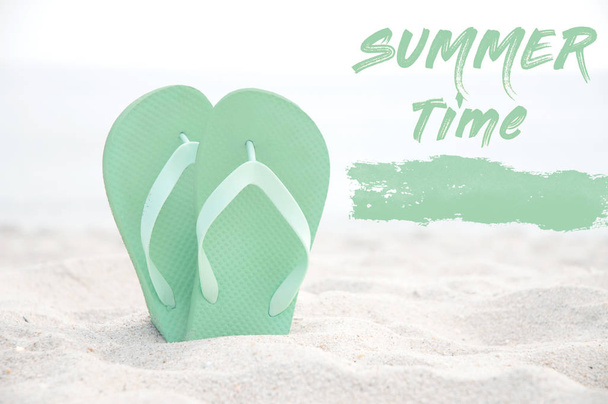 Flip flop on the white sand beach. Summer background  - 写真・画像