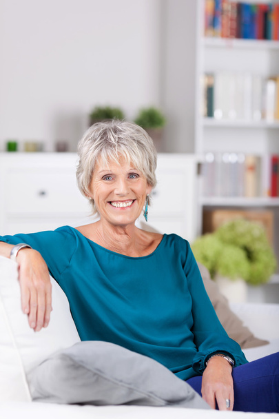 Senior Woman Sitting On Sofa At Home - Foto, Imagem