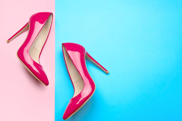 Stylish high heeled shoes on color background - Foto, Imagem