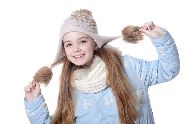 Happy little girl in warm clothes isolated on white background - Fotografie, Obrázek