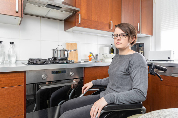 disabled woman cooking in the kitchen - 写真・画像