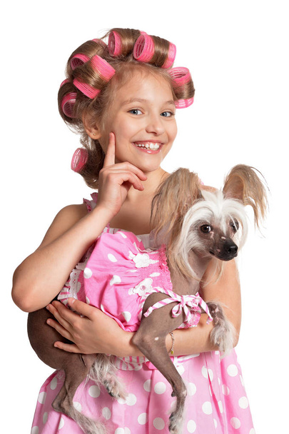 Little  girl   in hair curlers  with dog  - Valokuva, kuva