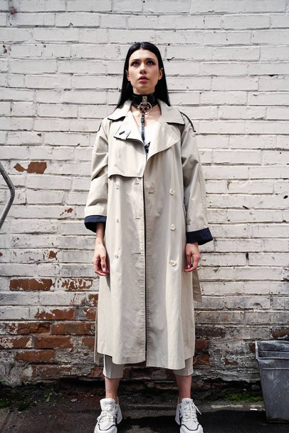  Beautiful Young Woman Posing in  trench coat          - Photo, Image