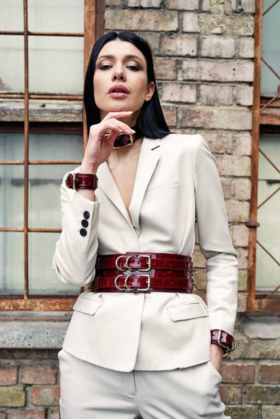 Beautiful Young Woman Posing in  leather necklace and jacket - 写真・画像
